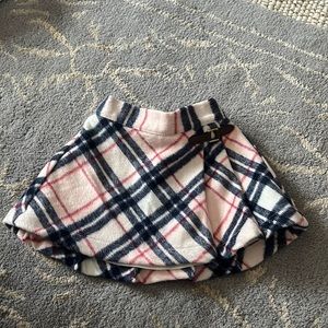 Janie and Jack poly/acrylic plaid skirt with faux leather “buckle”.